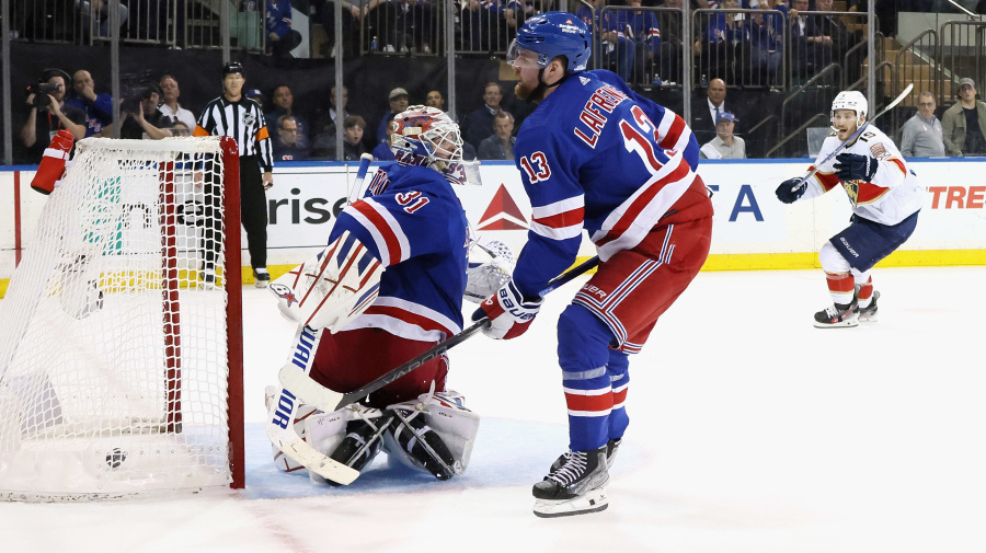 Getty Images - NEW YORK, NEW YORK - MAY 22: An own goal by The puck goes into his off ownoff Alexis Lafreniere #13 of the New York Rangers at 16:12 of the third period against the Florida Panthers  in Game One of the Eastern Conference Final of the 2024 Stanley Cup Playoffs at Madison Square Garden on May 22, 2024 in New York City. (Photo by Bruce Bennett/Getty Images)