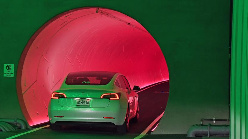 The red-lit round entryway into the Las Vegas Boring Company transit tunnel.