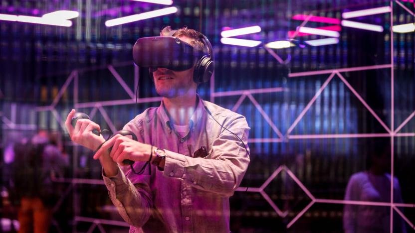 An attendee tries out the new Oculus Quest Virtual Reality (VR) gaming system at the Facebook F8 Conference at McEnery Convention Center in San Jose, California, on April 30, 2019. - Got a crush on another Facebook user? The social network will help you connect, as part of a revamp unveiled Tuesday that aims to foster real-world relationships and make the platform a more intimate place for small groups of friends. (Photo by Amy Osborne / AFP) (Photo by AMY OSBORNE/AFP via Getty Images)