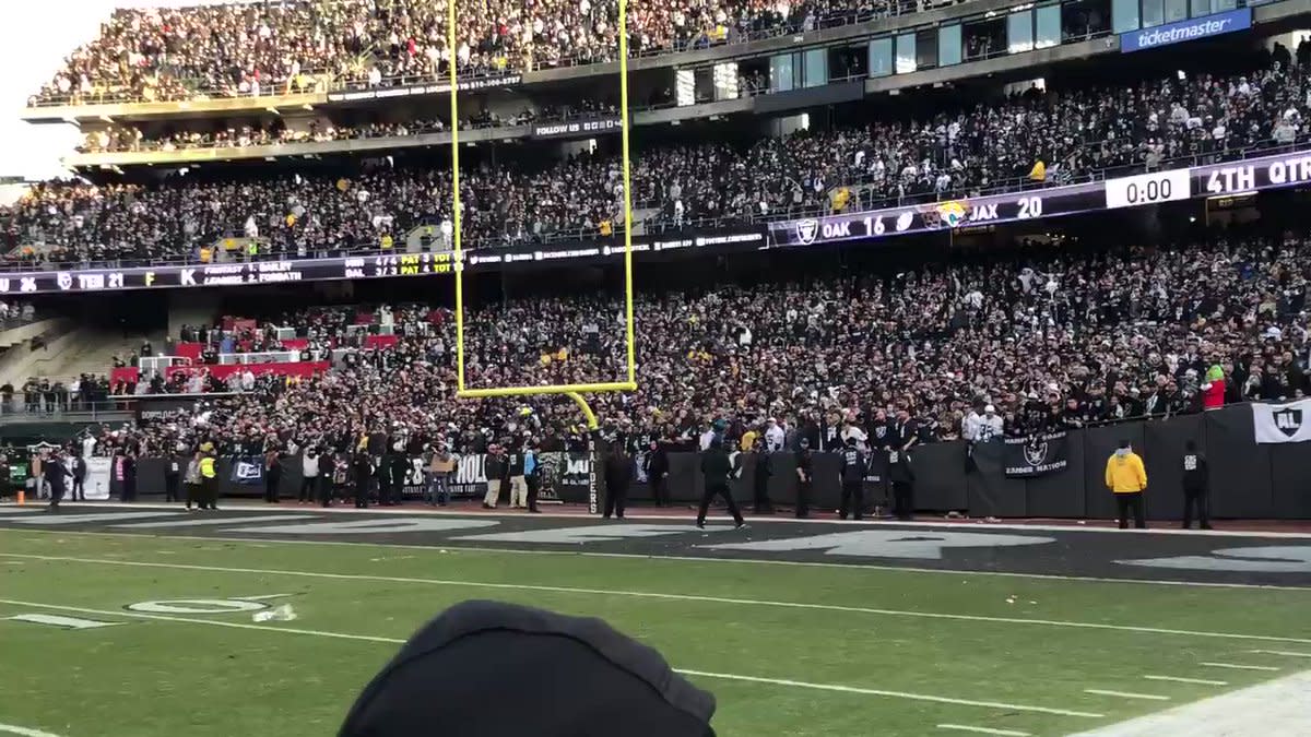 An Oakland Raiders fan is all decked out before the start of the