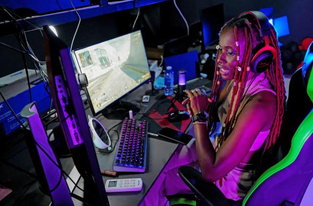 Ritalucia Ajuah Henry-Andoh, 22, aka Lady Legasus, a shoutcaster and streamer, commentates via a Twitch app channel during an online gaming tournament, in Accra, Ghana, August 21, 2022. 
