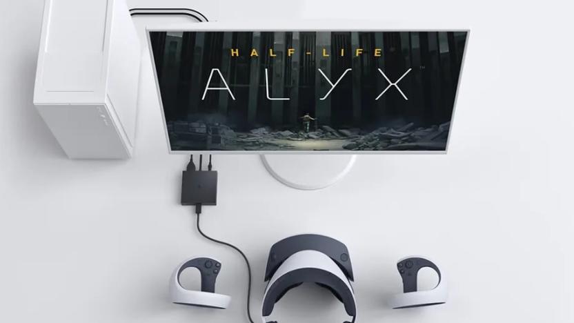 PS VR2 headset connected to a PC. The monitor shows the logo for Half-Life: Alyx.