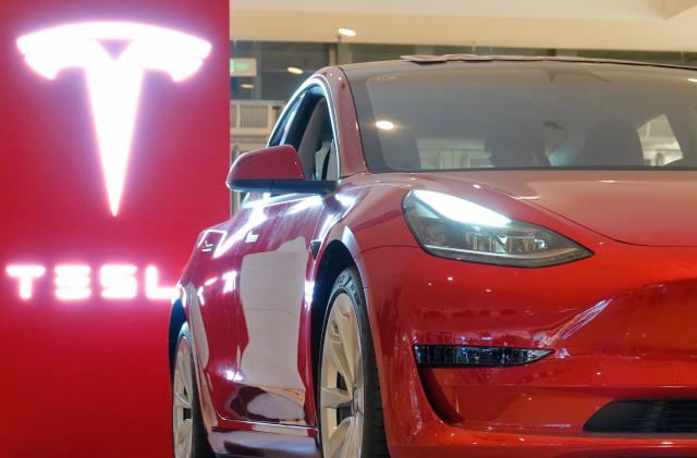 YANTAI, CHINA - OCTOBER 17, 2021 - A Tesla Model 3 is displayed at the Tesla Experience store in Joy City, Yantai, East China's Shandong Province, Oct 17, 2021. In September 2021, Tesla China set a new record of 56,006 vehicles. (Photo credit should read Tang Ke / Costfoto/Barcroft Media via Getty Images)