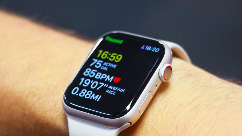 The Apple Watch Series 8 on a person's wrist, showing a paused workout tracking screen.