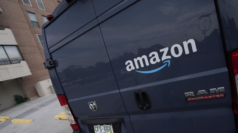 The company logo graces one of the doors of a delivery van for Amazon Wednesday, Sept. 1, 2021, in Denver. A labor organizer says more than 60 Amazon workers across three delivery stations staged a walkout on Wednesday, March 16, 2022, to demand a $3 raise and a return to 20-minute breaks. (AP Photo/David Zalubowski)