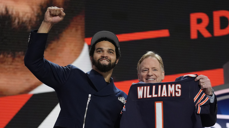 Associated Press - Southern California quarterback Caleb Williams celebrates with NFL commissioner Roger Goodell after being chosen by the Chicago Bears with the first overall pick during the first round of the NFL football draft, Thursday, April 25, 2024, in Detroit. (AP Photo/Jeff Roberson)