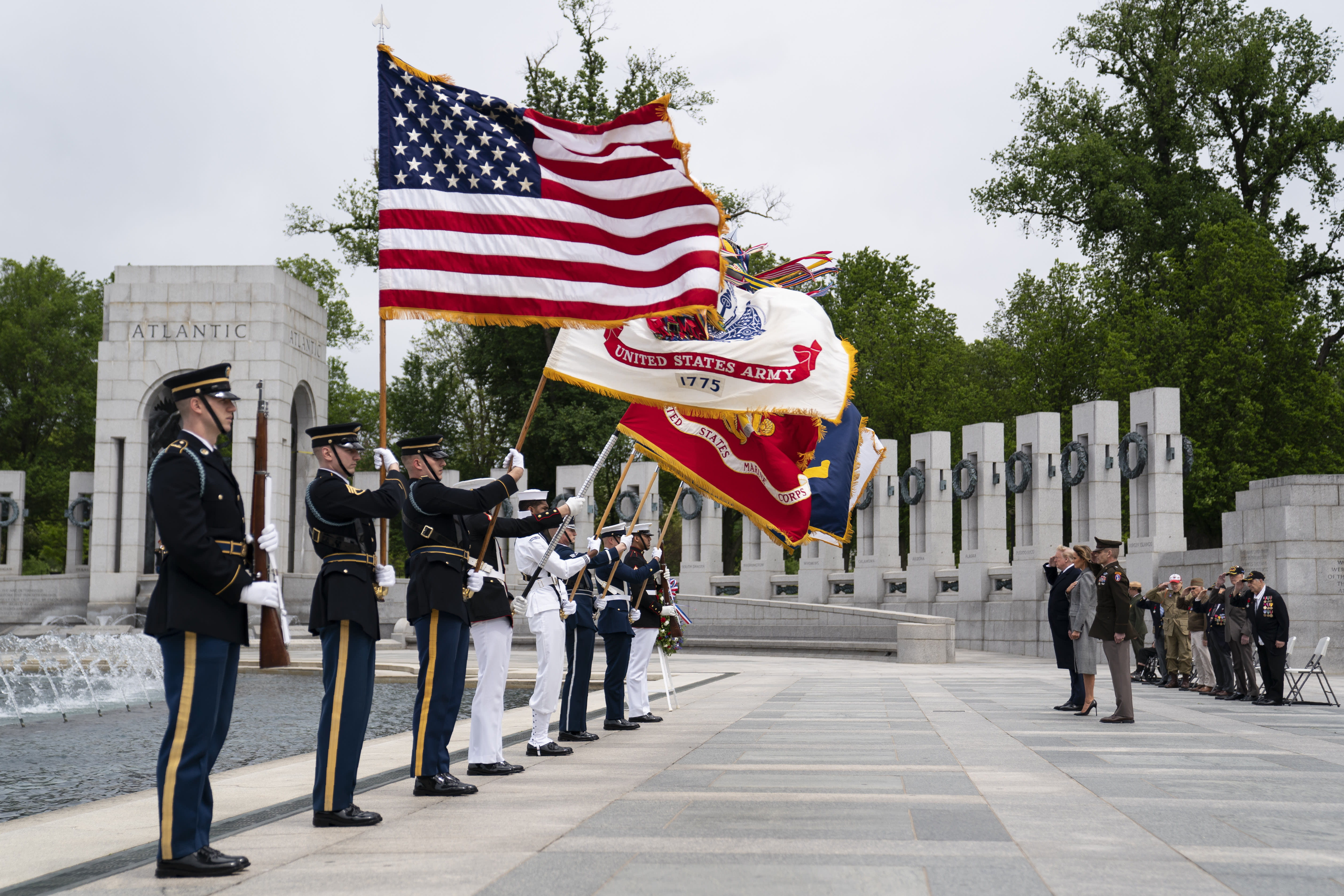 President Donald Trump and first lady Melania Trump participate in a wreath laying ceremony at the World War II Memorial to commemorate the 75th anniversary of Victory in Europe Day, Friday, May 8, 2020, in Washington. (AP Photo/Evan Vucci)