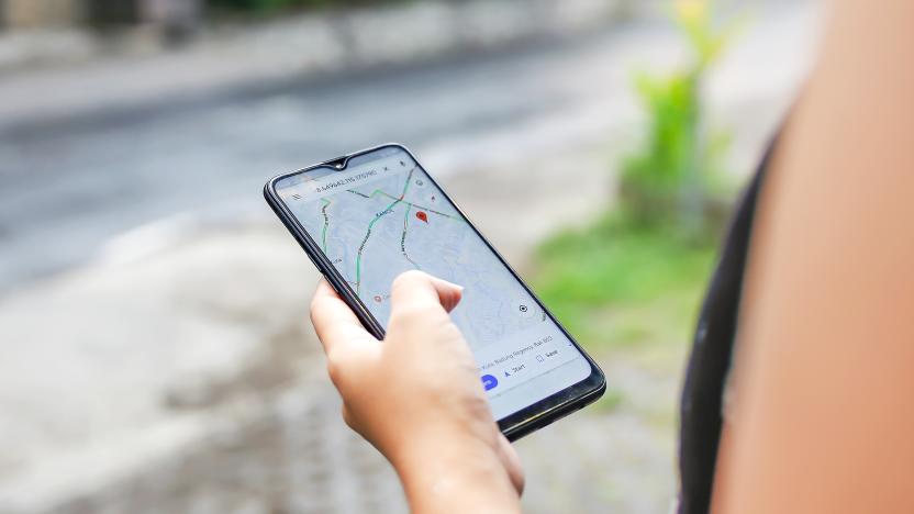 Bali,Indonesia, December 15, 2019 - Close up young woman using Google maps to check Covid - 19 community mobility reports to combat the virus spreading