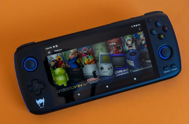 The Odin retro handheld by Ayn is pictured with Launchbox retro game launcher on screen.