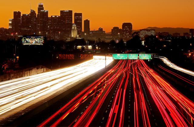 LOS ANGELES, CALIF. - NOV. 24, 2021. Traffic streams along the San Bernardino Freeway in downtown Los Angeles on Thanksgiving getaway day on Wednesday, Nov. 24, 2021. (Luis Sinco / Los Angeles Times via Getty Images)