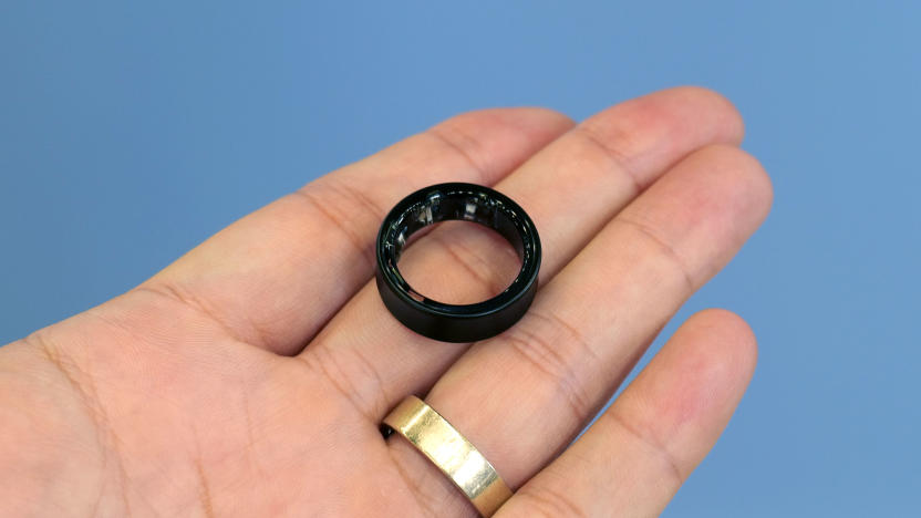 A black Samsung Galaxy Ring resting on a hand.
