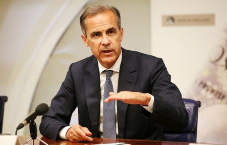 Sterling surges, FTSE falls on Carney rate hike signal