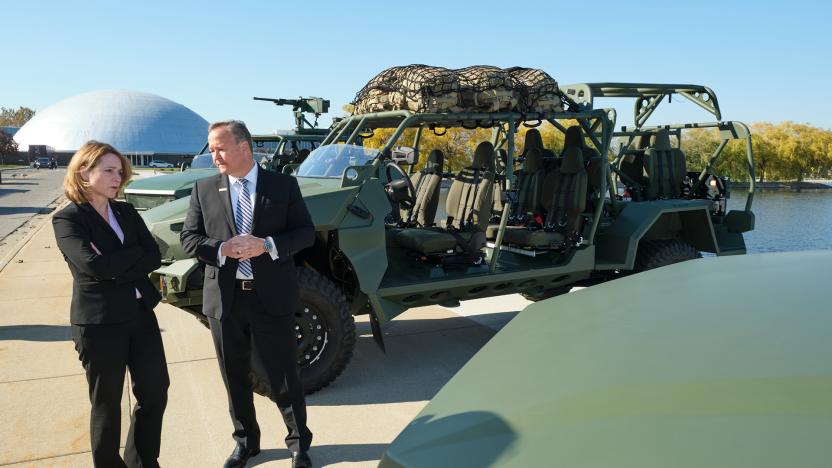 GM Defense President Steve duMont talks with U.S. Deputy Secretary of Defense Kathleen Hicks Monday, Nov. 8, 2021 at the GM Technical Center in Warren, Michigan.