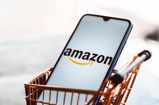 BRAZIL - 2021/09/01: In this photo illustration, an Amazon logo seen displayed on a smartphone along with a shopping cart. (Photo Illustration by Rafael Henrique/SOPA Images/LightRocket via Getty Images)