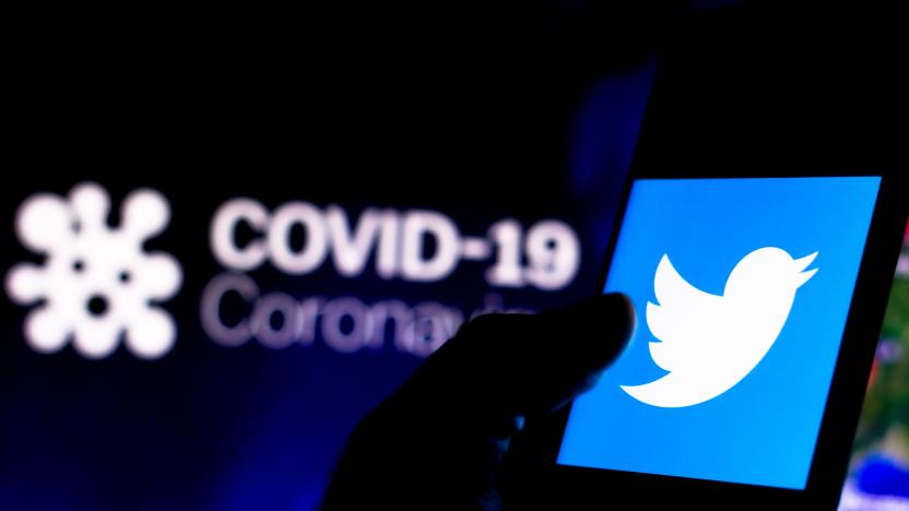 BRAZIL - 2020/04/08: In this photo illustration the Twitter logo seen displayed on a smartphone with a computer model of the COVID-19 coronavirus in the background. (Photo Illustration by Rafael Henrique/SOPA Images/LightRocket via Getty Images)