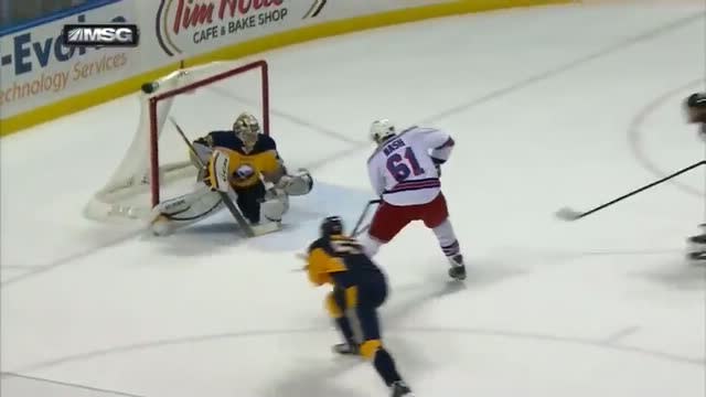 Rick Nash dekes around Ryan Miller for a goal