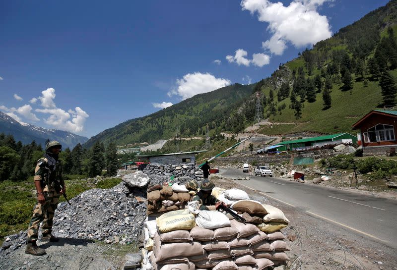 India's BSF soldiers stand guard at a checkpoint along a highway leading to Ladakh, at Gagangeer