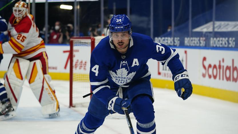 Apr 13, 2021; Toronto, Ontario, CAN; Toronto Maple Leafs forward Auston Matthews (34) kates towards the boaerds against the Calgary Flames during the third period at Scotiabank Arena. Mandatory Credit: John E. Sokolowski-USA TODAY Sports