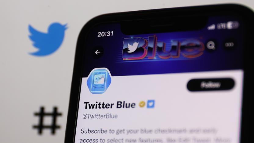 The golden checkmark on Twitter Blue account on Twitter displayed on a phone screen and Twitter website displayed on a screen in the background are seen in this illustration photo taken in Krakow, Poland on February 14, 2023 (Photo by Jakub Porzycki/NurPhoto via Getty Images)