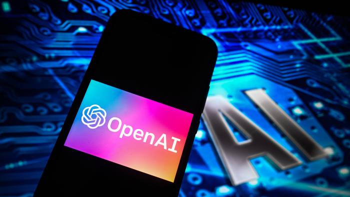 POLAND - 2024/09/30: In this photo illustration an OpenAi logo is displayed on a smartphone with AI symbol on the background. (Photo Illustration by Omar Marques/SOPA Images/LightRocket via Getty Images)