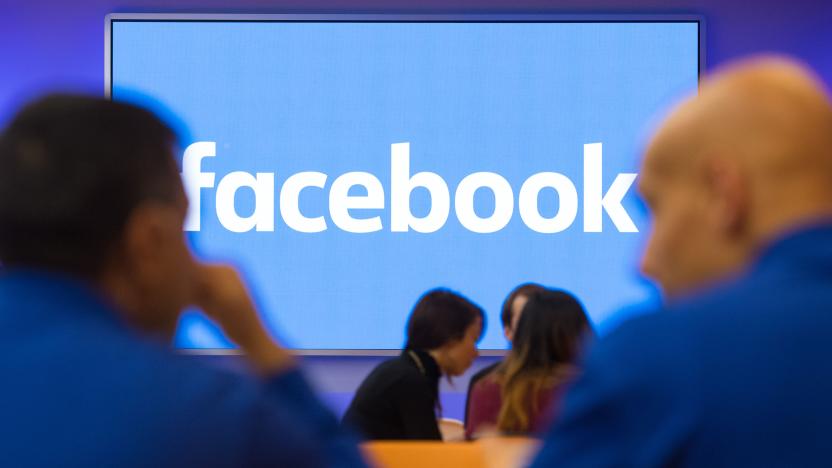 A Facebook logo is displayed on a screen at Facebook's new Frank Gehry-designed headquarters at Rathbone Place in London. (Photo by Dominic Lipinski/PA Images via Getty Images)