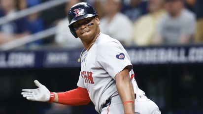 Getty Images - ST PETERSBURG, FLORIDA - MAY 20: Rafael Devers #11 of the Boston Red Sox reacts after hitting a two run home run during the third inning against the Tampa Bay Rays continuing his home run streak to six games in a row at Tropicana Field on May 20, 2024 in St Petersburg, Florida. (Photo by Douglas P. DeFelice/Getty Images)