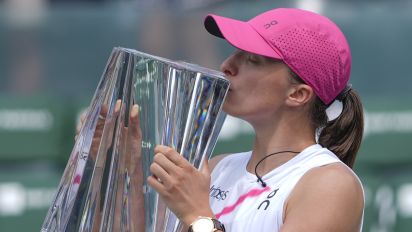 Associated Press - Iga Swiatek, of Poland, kisses the trophy after defeating Maria Sakkari, of Greece, in the final match at the BNP Paribas Open tennis tournament, Sunday, March 17, 2024, in Indian Wells, Calif. (AP Photo/Ryan Sun)