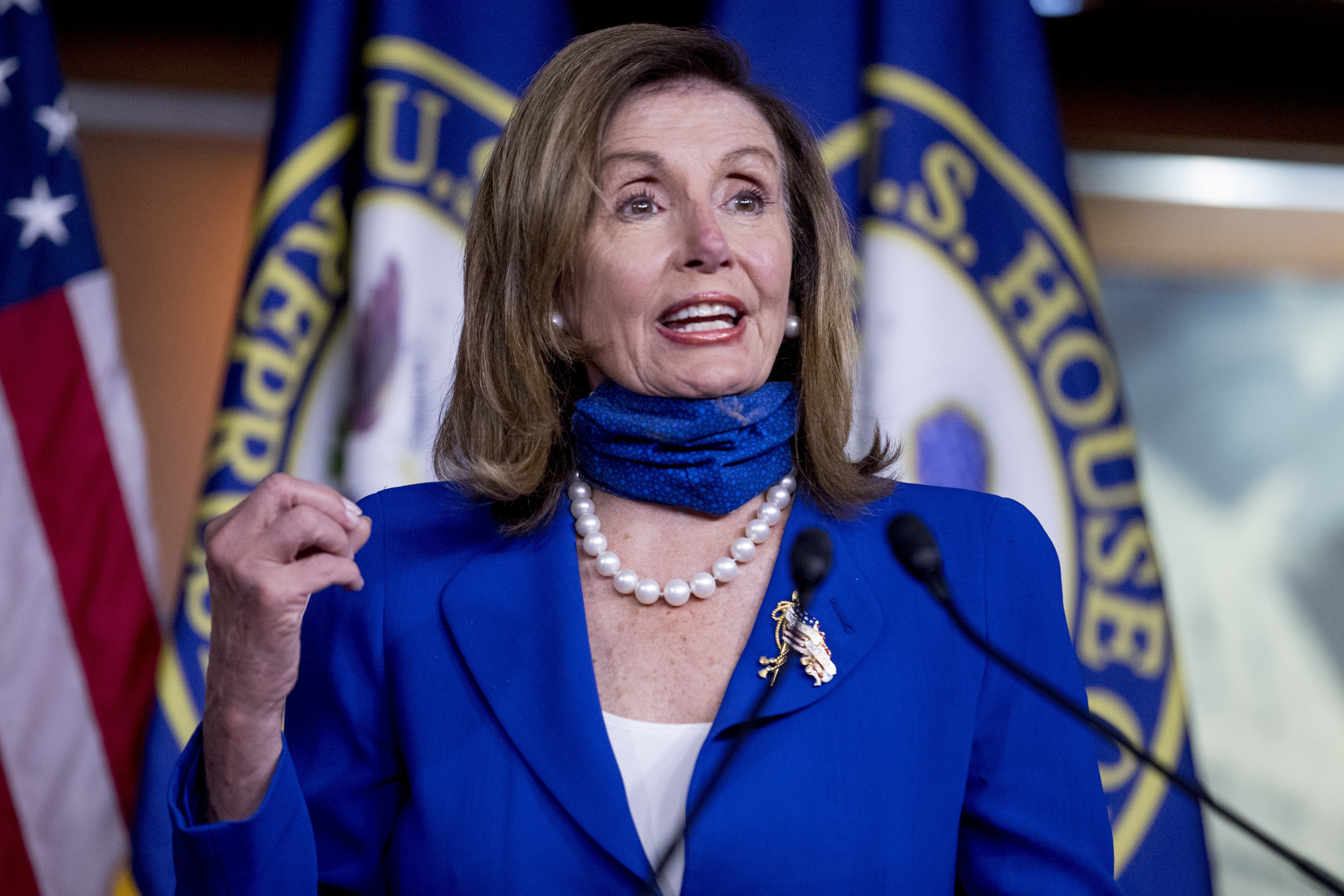 FILE - In this July 29, 2020, file photo House Speaker Nancy Pelosi of Calif. speaks at a press conference on Capitol Hill in Washington. This election year's battle for control of the House is once again hinging heavily on a fight over suburban voters. Democrats boast an ever-expanding target list that includes a half-dozen Republican seats in Texas plus others outside Atlanta, Cincinnati, Los Angeles and Phoenix. (AP Photo/Andrew Harnik, File)