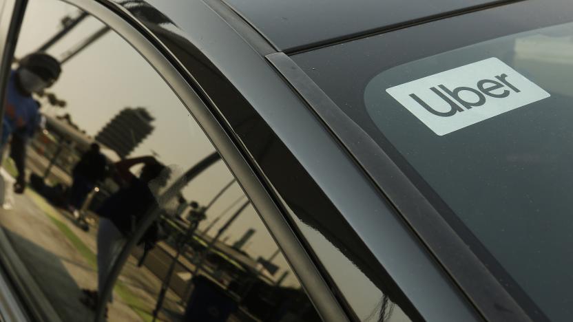 LAX AIRPORT, CA - AUGUST 20:          Passengers connect with drivers at the Rideshare Lot at LAX as Uber and Lyft drivers held a moving rally as part of a statewide day of action to demand that both ride-hailing companies follow California law and grant drivers basic employee rights and to denounce the corporations efforts to avoid their responsibilities to workers. Uber and Lyft threatened to suspend services in California Thursday night but a court granted Uber and Left a stay to a preliminary injunction requiring both rideshare companies to reclassify their drivers as employees, meaning the rideshare companies will not suspend service in California tonight as they threatened.   Los Angeles on Thursday, Aug. 20, 2020 in LAX Airport, CA. (Al Seib / Los Angeles Times