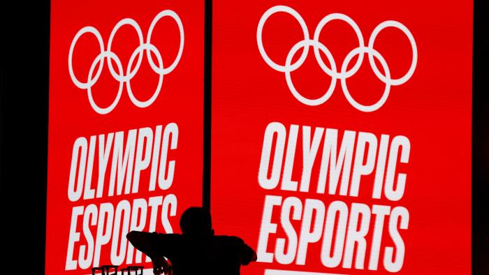 A crew member arranges trophies to be awarded at the Olympic Esports Week in Singapore June 23, 2023. REUTERS/Edgar Su