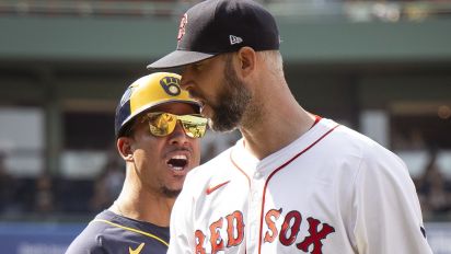  - An argument between Boston Red Sox reliever Chris Martin and Milwaukee Brewers first base coach Quintin Berry caused a bench-learing confrontation at Fenway Park on