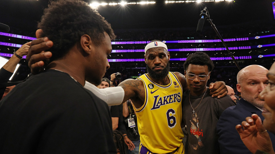 Getty Images - LOS ANGELES, CALIFORNIA - FEBRUARY 07: LeBron James #6 of the Los Angeles Lakers reacts with Bronny James and Bryce James after scoring to pass Kareem Abdul-Jabbar to become the NBA's all-time leading scorer, surpassing Abdul-Jabbar's career total of 38,387 points against the Oklahoma City Thunder at Crypto.com Arena on February 07, 2023 in Los Angeles, California. NOTE TO USER: User expressly acknowledges and agrees that, by downloading and or using this photograph, User is consenting to the terms and conditions of the Getty Images License Agreement. (Photo by Harry How/Getty Images)