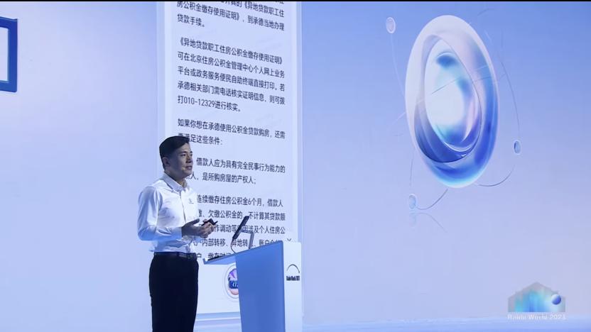 Robin Li standing at a lectern, demonstrating ERNIE 4.0