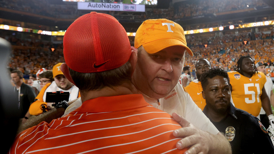 Getty Images - MIAMI GARDENS, FLORIDA - DECEMBER 30: Head coach Josh Heupel (R) of the Tennessee Volunteers hugs head coach Dabo Swinney (L) of the Clemson Tigers after the Capital One Orange Bowl at Hard Rock Stadium on December 30, 2022 in Miami Gardens, Florida. (Photo by Megan Briggs/Getty Images)