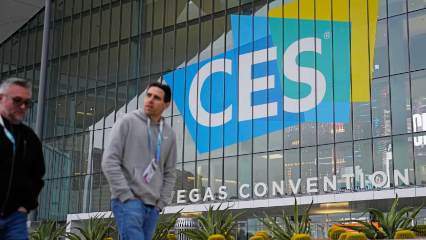 People walk by the Las Vegas Convention Center during setup ahead of the CES tech show Saturday, Jan. 6, 2024, in Las Vegas.