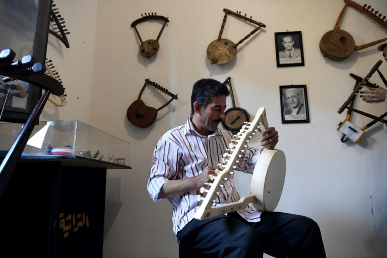 Egyptian craftsman                                                  Mohamed Ghaly adds the                                                  finishing touches on a                                                  semsemia that he made at                                                  the Canal 20 cultural                                                  museum in Port Said                                                  which he founded to pass                                                  on the musical heritage                                                  to a new generation (AFP                                                  Photo/Khaled DESOUKI)