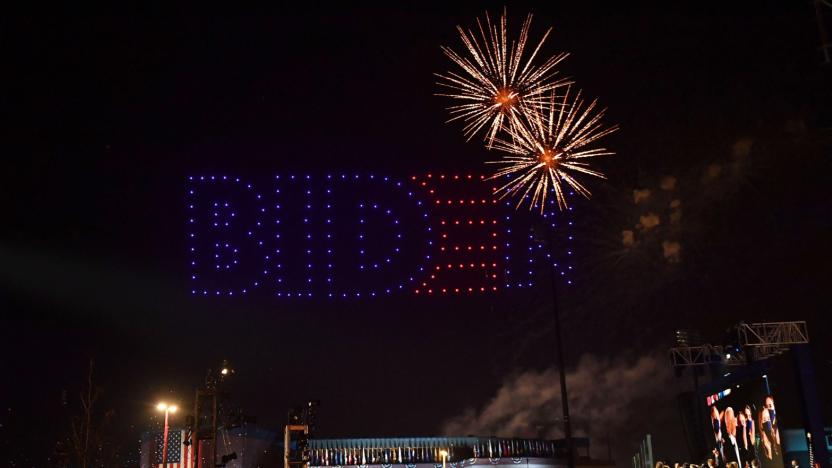 Fireworks are launched as illuminated drones spell BIDEN in the sky as US President-elect Joe Biden with his wife doctor Jill Biden alongside Vice President-elect Kamala Harris and her husband Douglas Emhoff and their families watch in Wilmington, Delaware, on November 7, 2020, after being declared the winners of the presidential election. - Democrat Joe Biden was declared winner of the US presidency November 7, defeating Donald Trump and ending an era that convulsed American politics, shocked the world and left the United States more divided than at any time in decades. (Photo by ANGELA  WEISS / AFP) (Photo by ANGELA  WEISS/AFP via Getty Images)