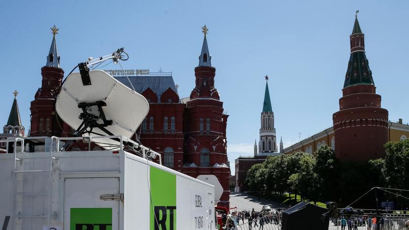 Vehicles of Russian state-controlled broadcaster Russia Today (RT) are seen near the Red Square in central Moscow, Russia June 15, 2018. Picture taken June 15, 2018.  REUTERS/Gleb Garanich