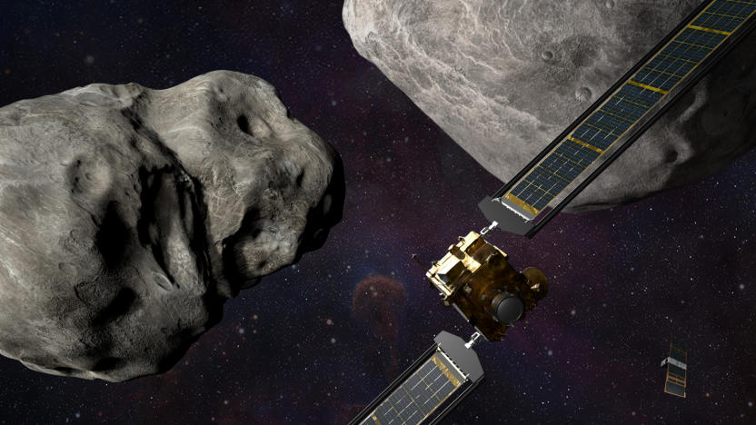 An artist's depiction of NASA's DART spacecraft approaching asteroids.