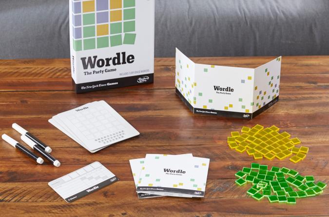 The physical Wordle home game and all its pieces are displayed on a living room coffee table.
