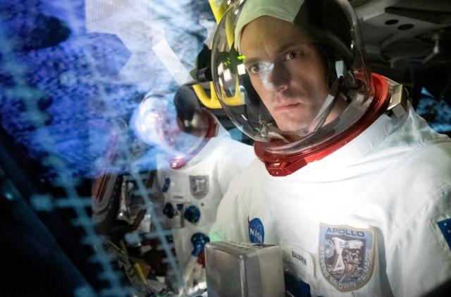 A still from the Apple TV space series 'For All Mankind' showing an astronaut and reflection in glass behind him.