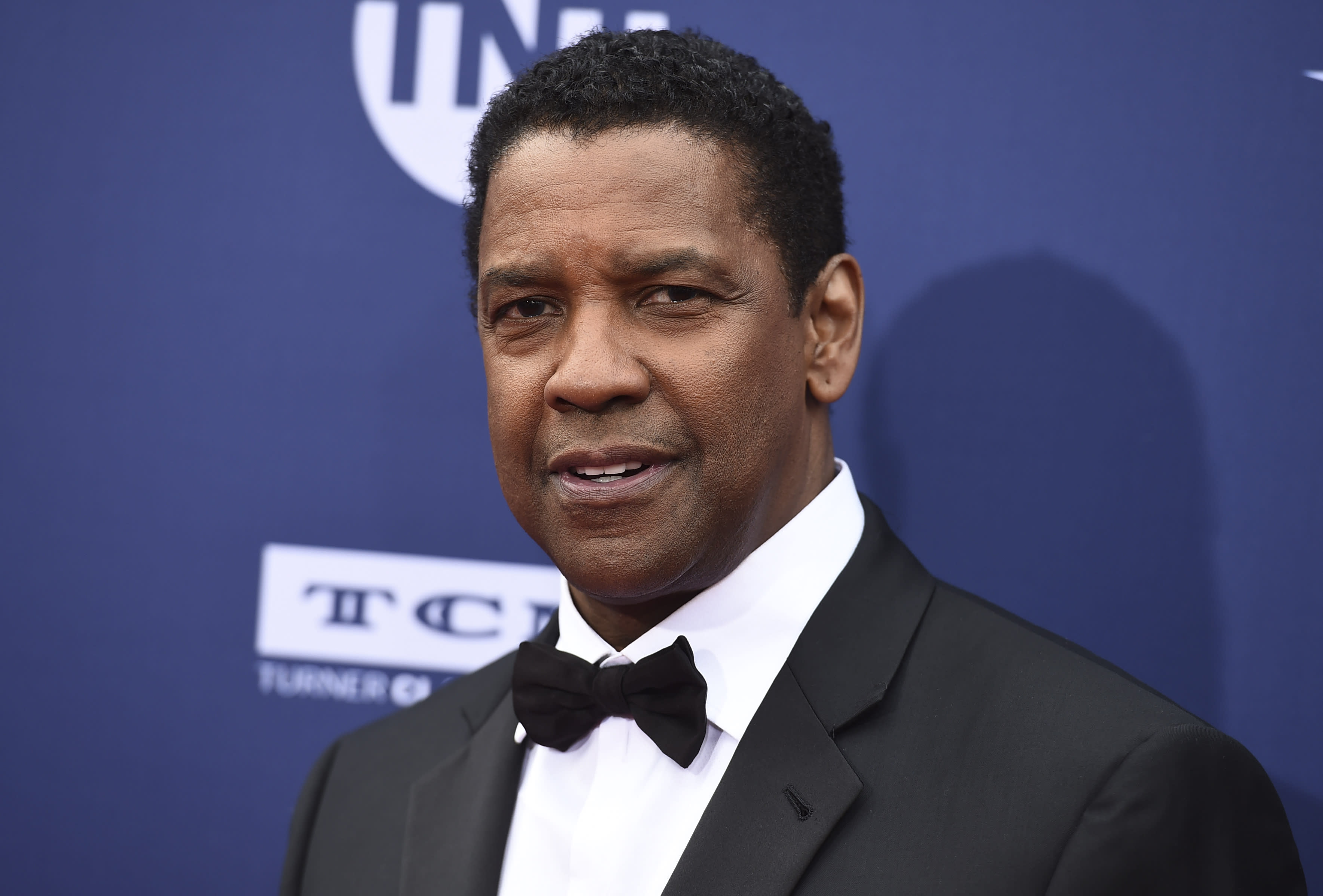 Denzel Washington proclaimed a real-life hero after video shows him helping a homeless man in police encounter - Yahoo Entertainment