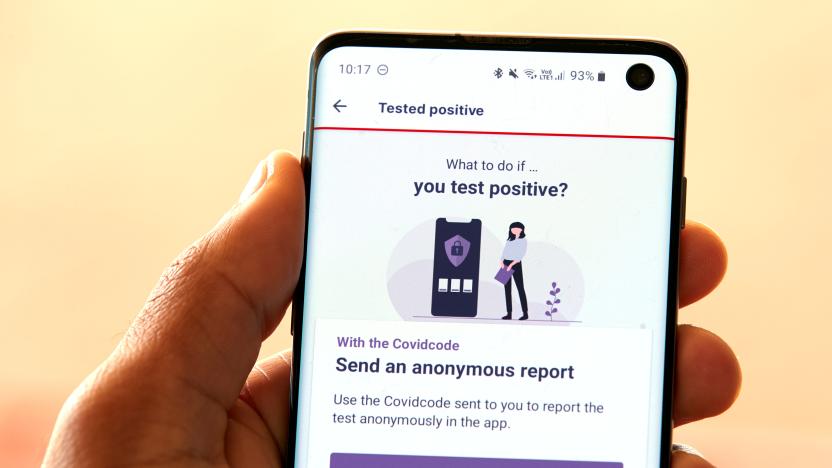 An EPFL staff displays the tracing application "SwissCovid" on his mobile device on the second day of the pilot for the app based on Google and Apple protocols during the coronavirus disease (COVID-19) outbreak at the Swiss Federal Institute of Technology Lausanne in Lausanne, Switzerland May 26, 2020. REUTERS/Denis Balibouse