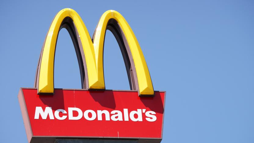 Ljubljana, Slovenia - September 3, 2011: Close-up of McDonalds outdoor sign with  typical rounded yellow M letter against cloudless blue sky. Sign is positioned on the left side of image.