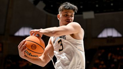 Getty Images - MORGANTOWN, WEST VIRGINIA - JANUARY 20: Kerr Kriisa #3 of the West Virginia Mountaineers grabs a rebound against the Kansas Jayhawks at WVU Coliseum on January 20, 2024 in Morgantown, West Virginia. (Photo by G Fiume/Getty Images)