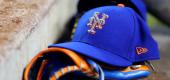 A New York Mets hat is seen on the dugout steps. (Getty Images)