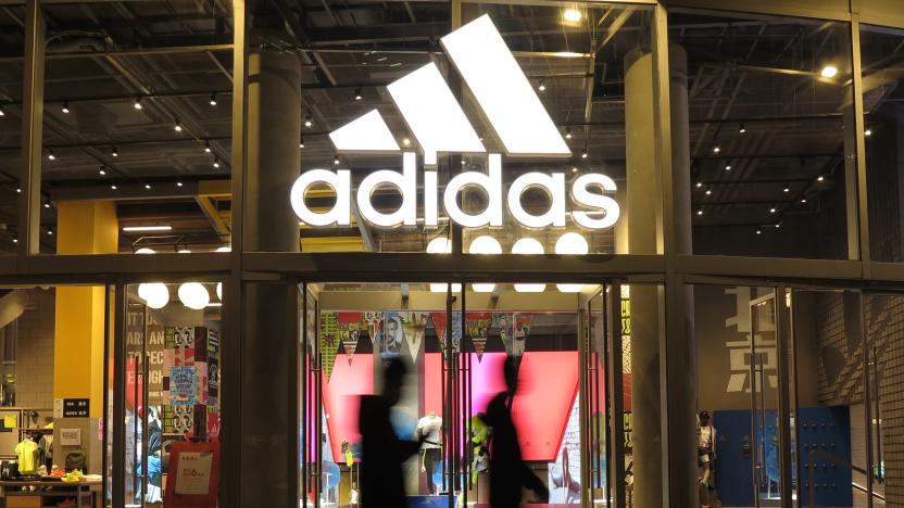 BEIJING, CHINA - APRIL 28: People walk past an Adidas store on April 28, 2021 in Beijing, China. (Photo by Lu Qijian/VCG via Getty Images)