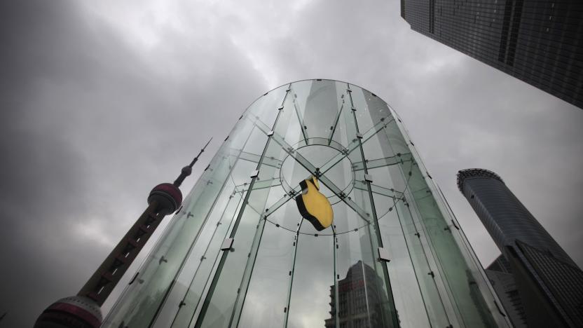 An Apple logo is seen at an Apple store in Pudong, the financial district of Shanghai February 29, 2012.  A long-running legal fight between Apple Inc and a debt-laden Chinese firm over the iPad trademark moved to a higher court on Wednesday, in a potentially decisive hearing that will set a precedent for the rest of mainland China. The Higher People's Court of Guangdong is hearing an appeal by the U.S. firm after a lower court ruled in favour of Proview Technology, which says it owns the trademark in China and is trying to stop sales there of Apple's wildly popular tablet computer. REUTERS/Carlos Barria (CHINA - Tags: BUSINESS SCIENCE TECHNOLOGY CRIME LAW)