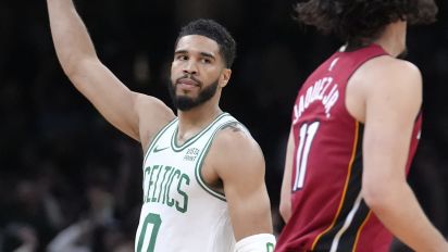 Associated Press - Boston Celtics forward Jayson Tatum (0) celebrates in front of Miami Heat guard Jaime Jaquez Jr. (11) as the Celtics lead in the first half of Game 1 of an NBA basketball first-round playoff series, Sunday, April 21, 2024, in Boston. (AP Photo/Steven Senne)