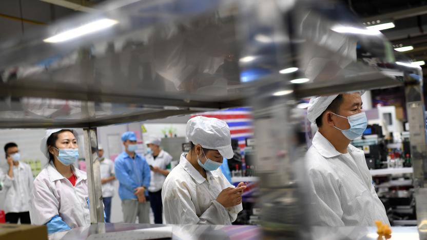 WUHAN, CHINA - AUGUST 05 2021: Workers in the Foxconn factory line up for the all-inclusive Covid-19 test in Wuhan in central China&#039;s Hubei province Thursday, Aug. 05, 2021. Forty-six spots of samples collection were set up across the compound of the electronics manufacturer to minimize the queuing time of the 20,000-plus workers. (Photo credit should read Feature China/Future Publishing via Getty Images)